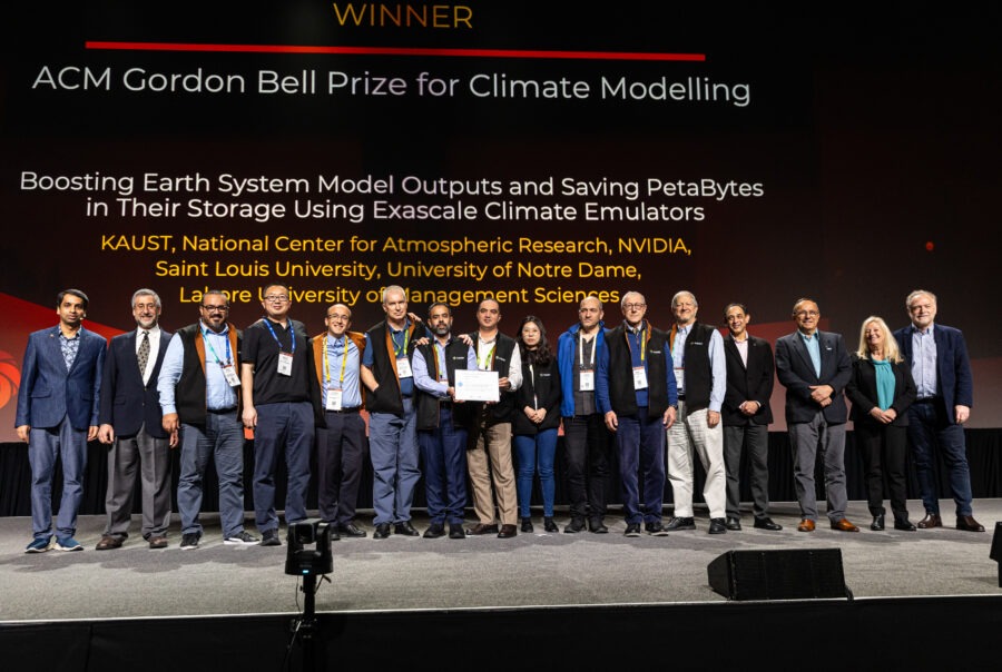 Award recipients of the 2024 Gordon Bell Prize for Climate Modelling stand on stage