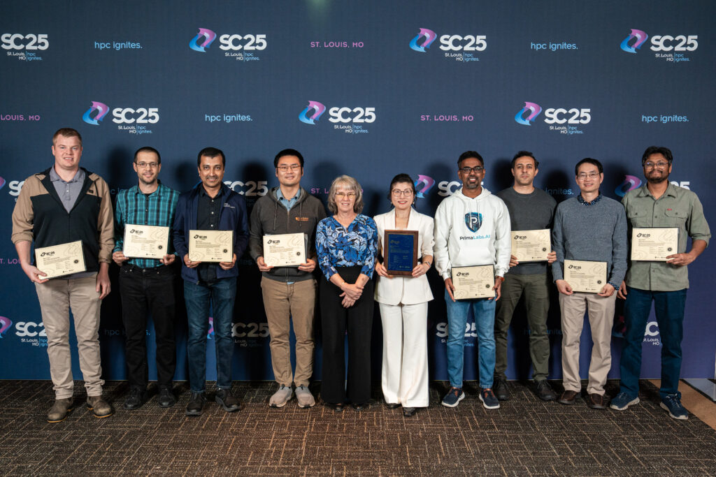 A group of people standing holding awards for Best Paper 2025.